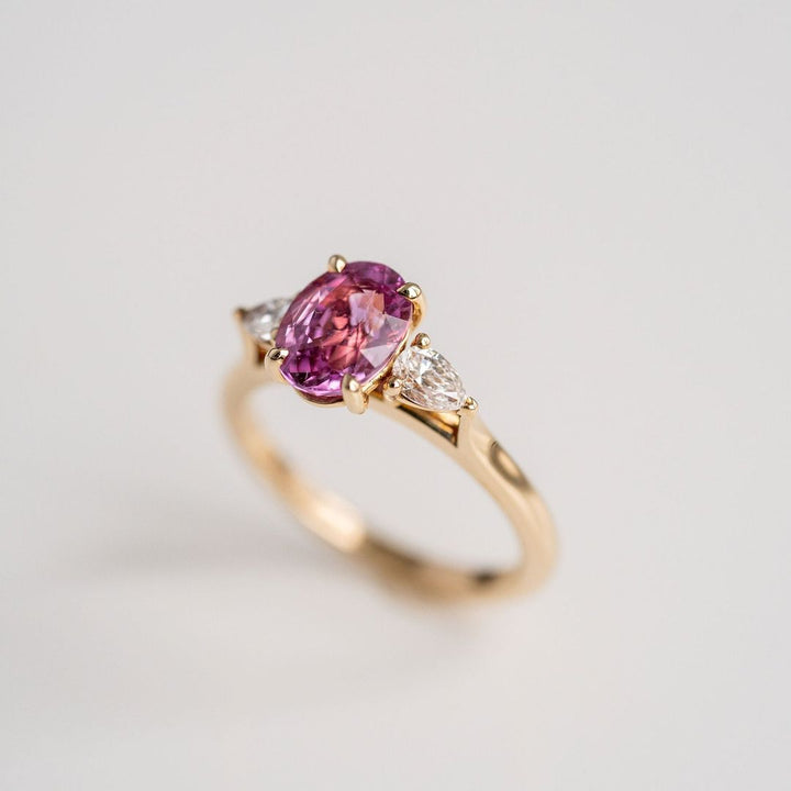 Oval Vivid Pink Sapphire With Pear Shape Diamond Accents