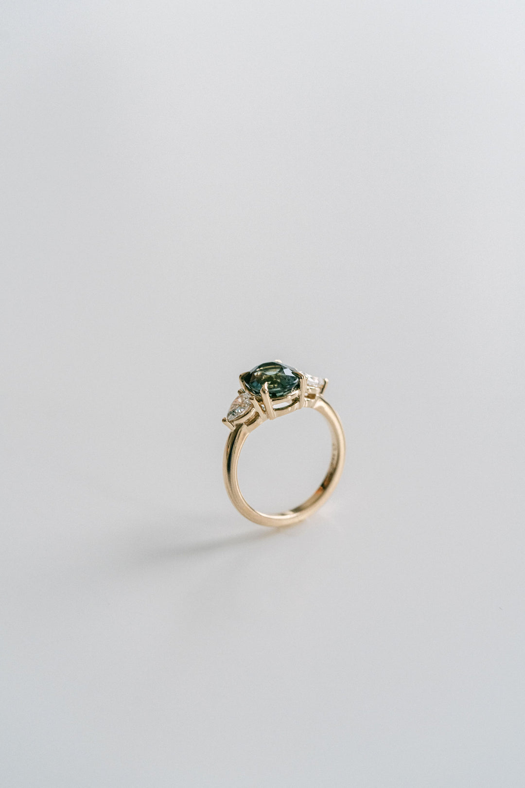 Oval Blue-Green Sapphire With Pear Shape Diamond Accents