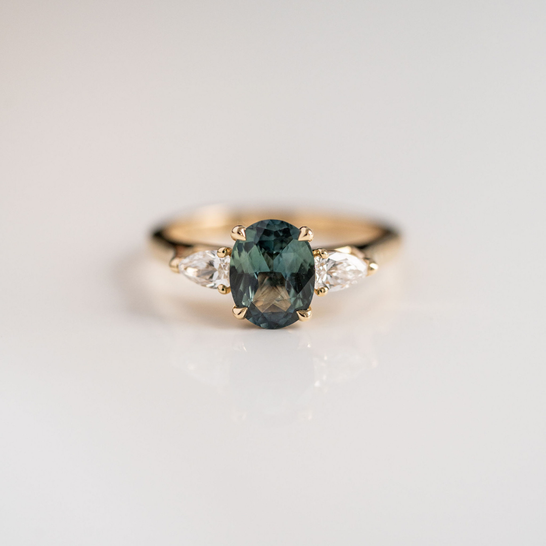 Oval Blue-Green Sapphire With Pear Shape Diamond Accents
