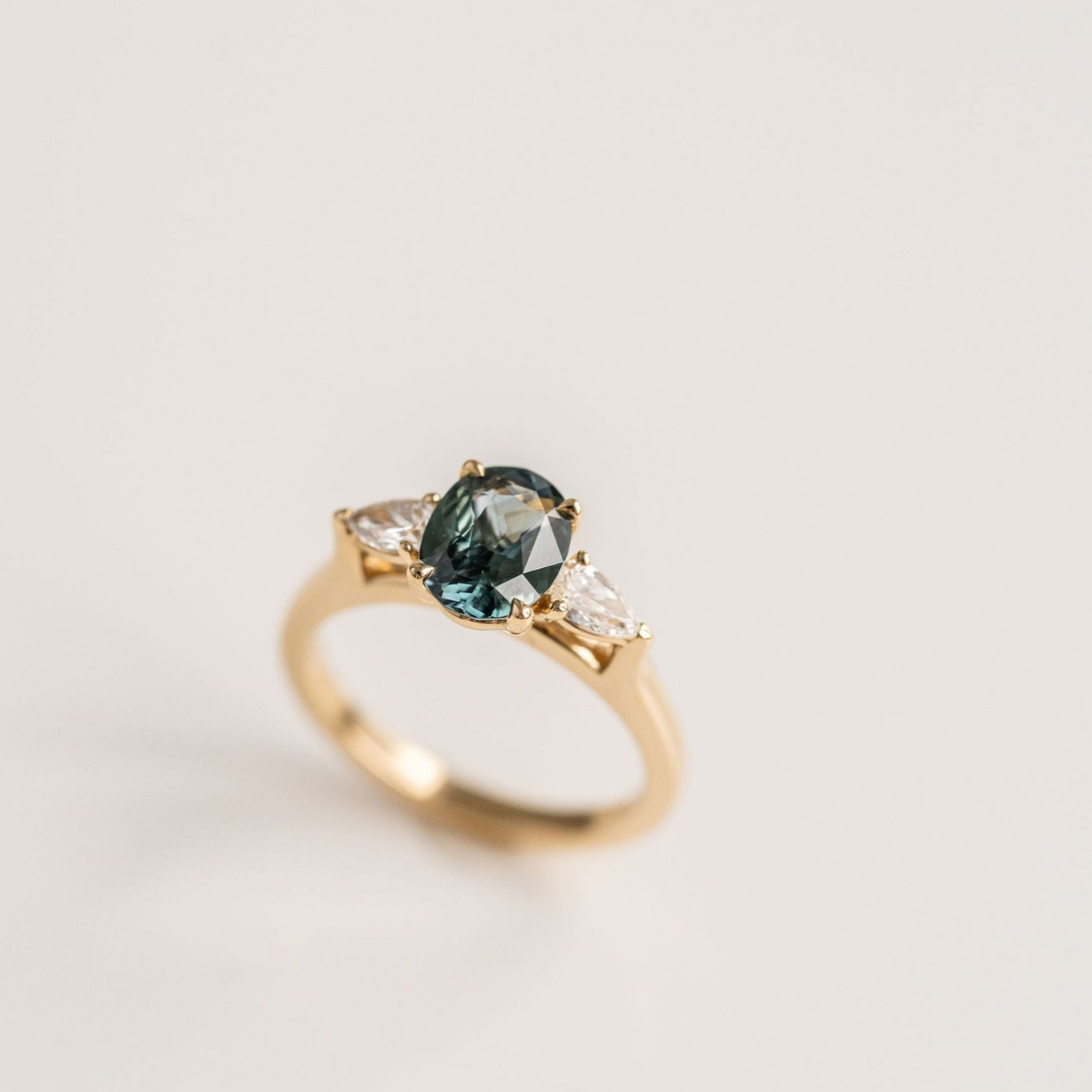 Oval Blue-Green Sapphire With Pear Shape Diamond Accents