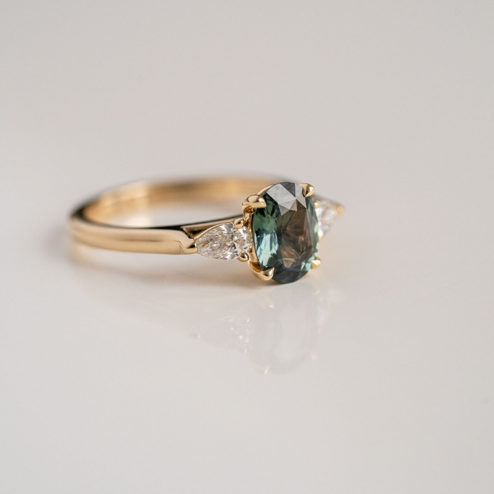 Oval Blue-Green Sapphire With Pear Shape Diamond Accents