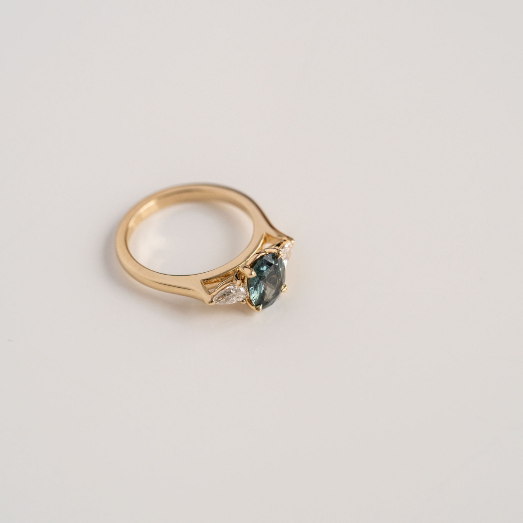 Oval Blue-Green Sapphire With Pear Shape Diamond Accents