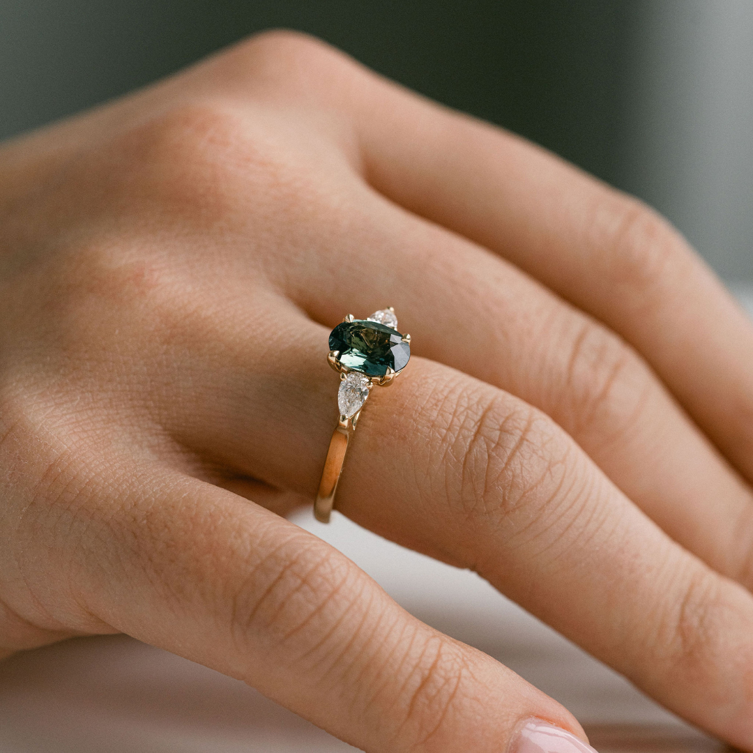 Oval Blue-Green Sapphire With Pear Shape Diamond Accents