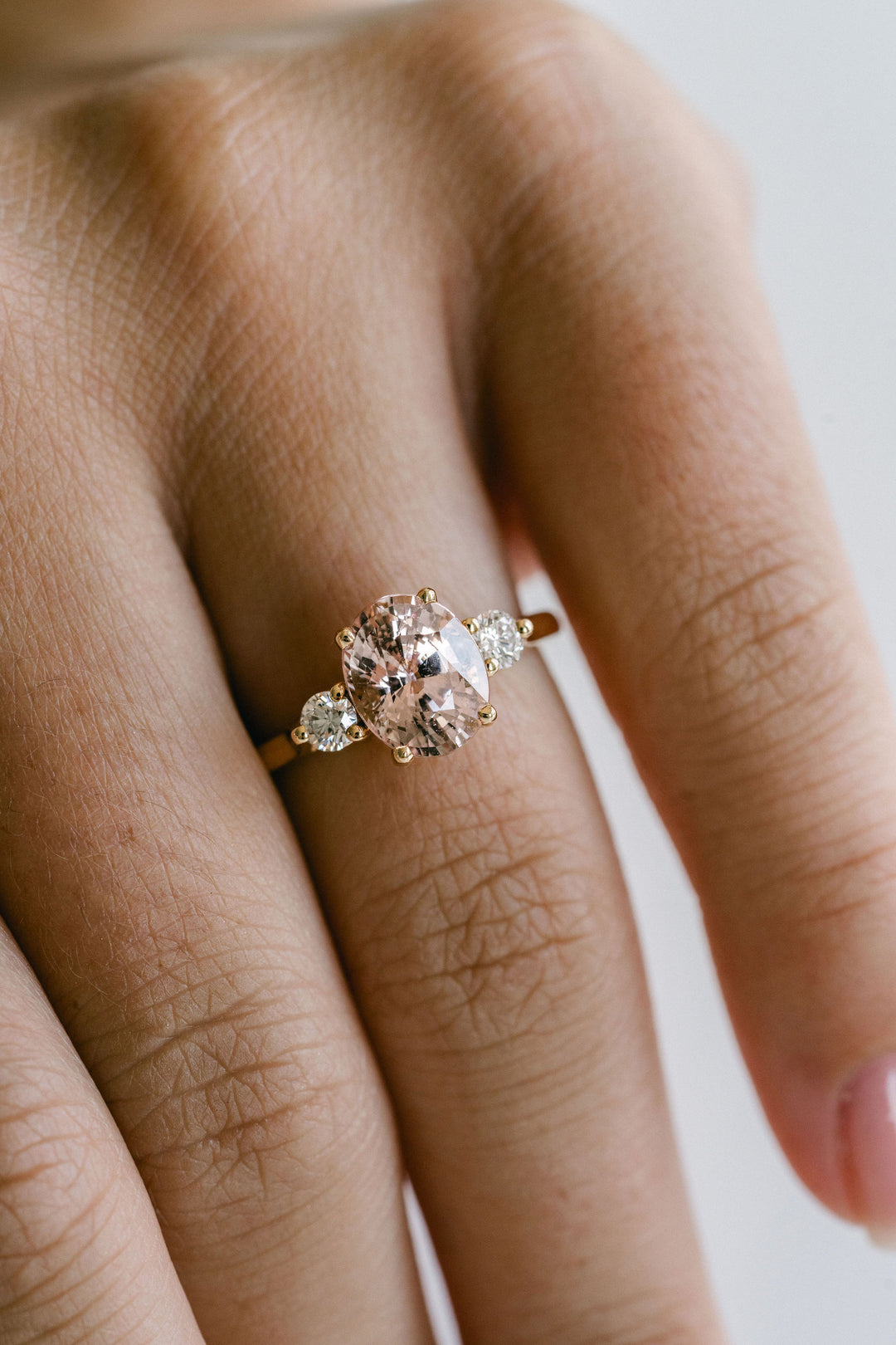 Oval Peach-Pink Sapphire With Round Diamond Accents