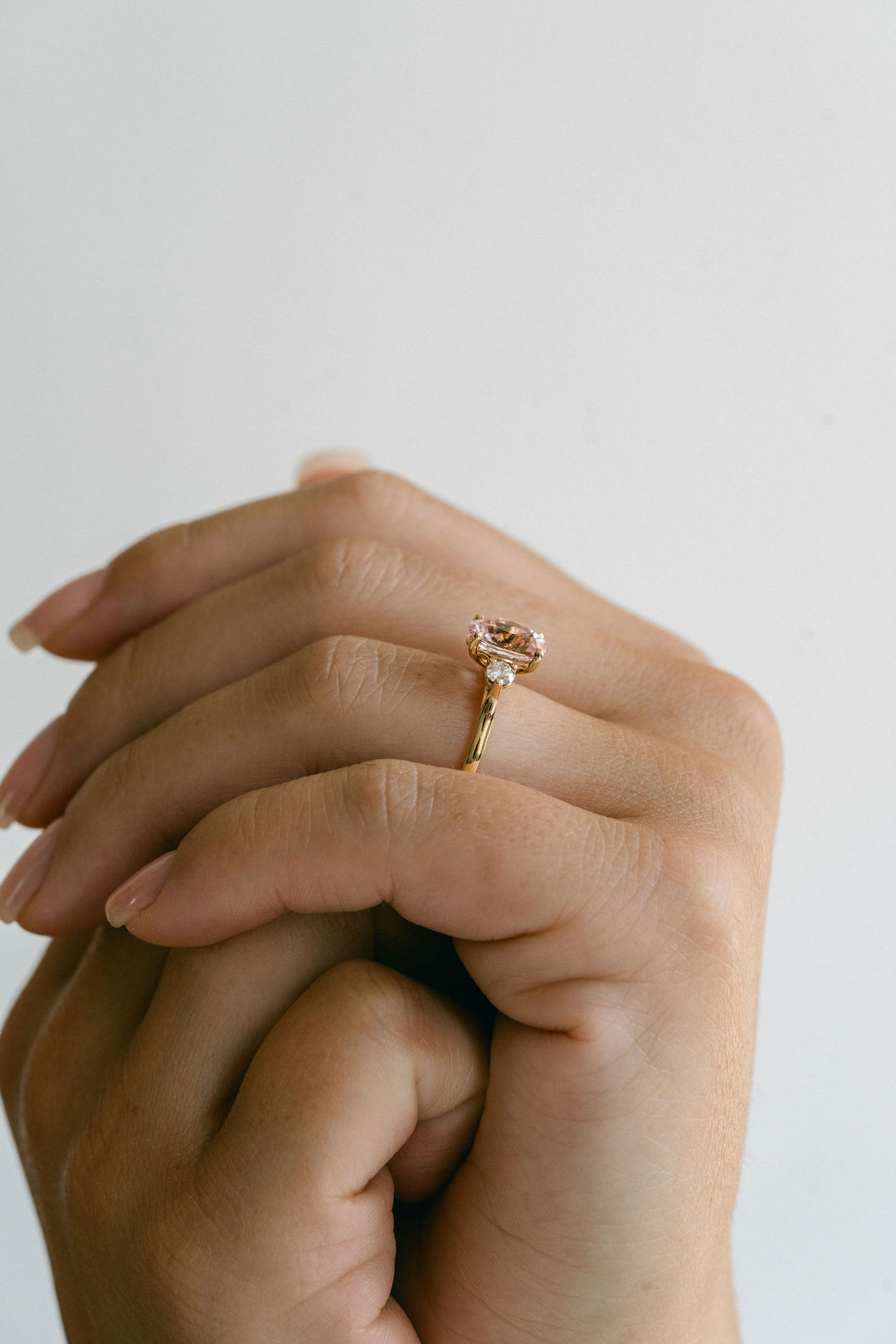 Oval Peach-Pink Sapphire With Round Diamond Accents