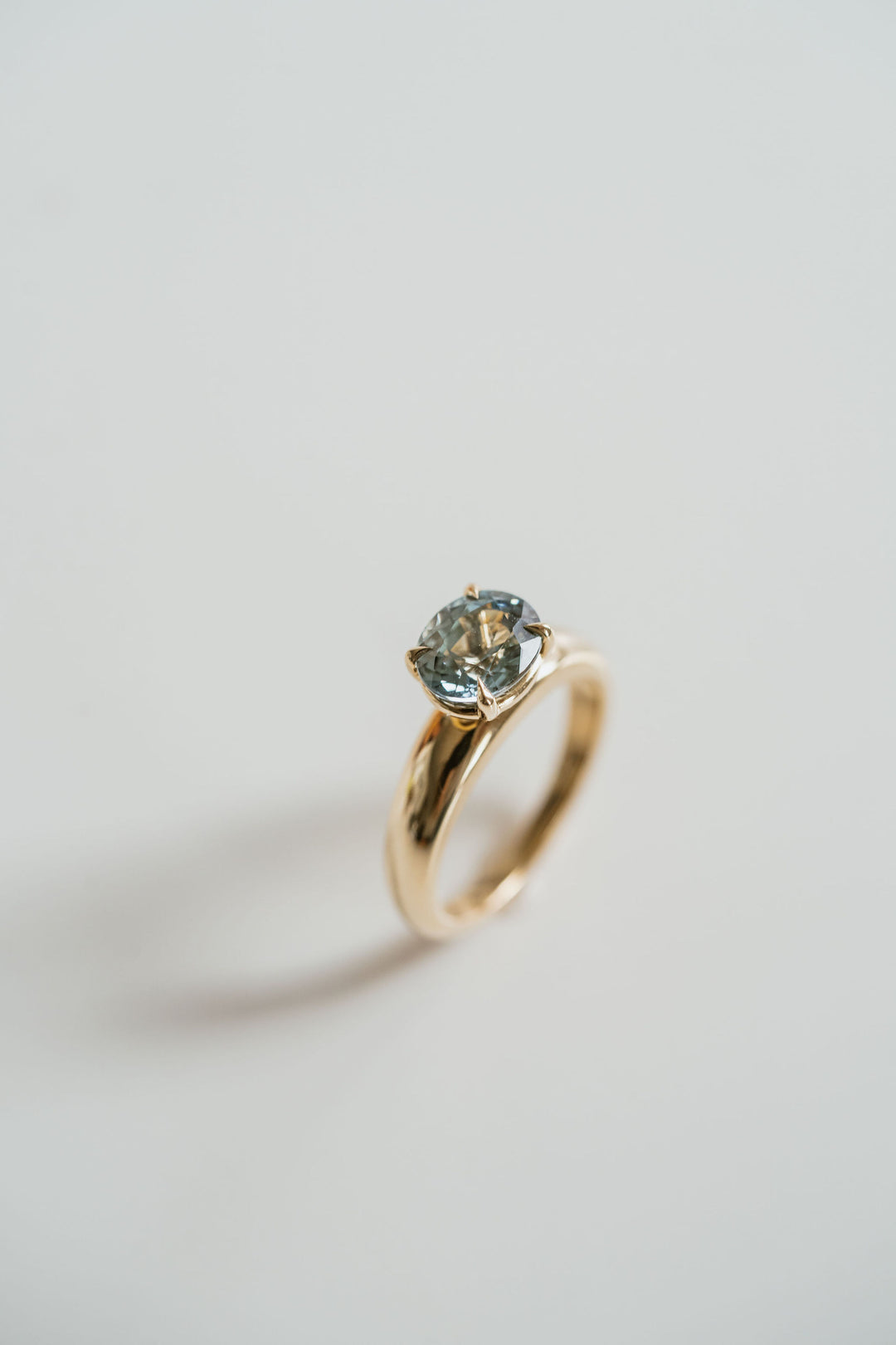 Oval Teal Sapphire East-West Arc Ring