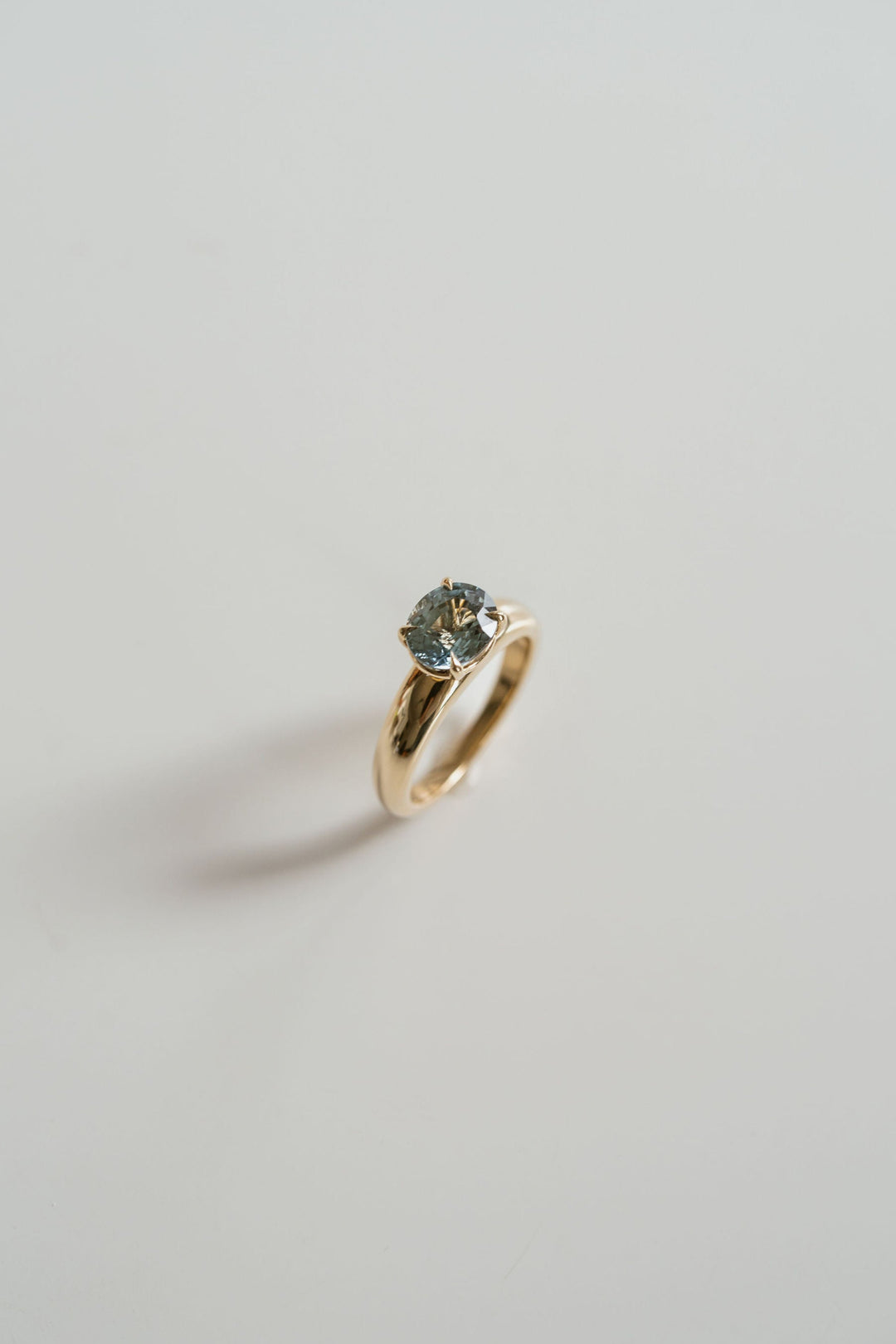 Oval Teal Sapphire East-West Arc Ring