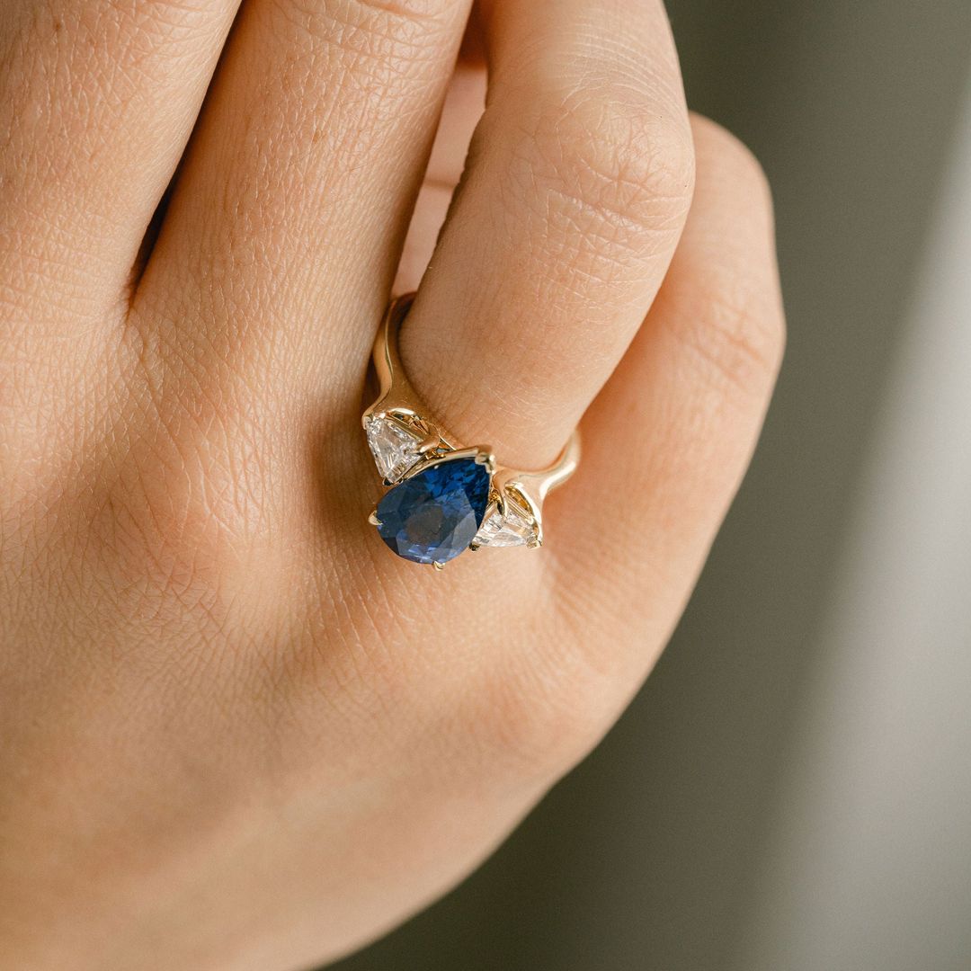 Pear Shape Blue Sapphire With Shield Shape Diamond Accents