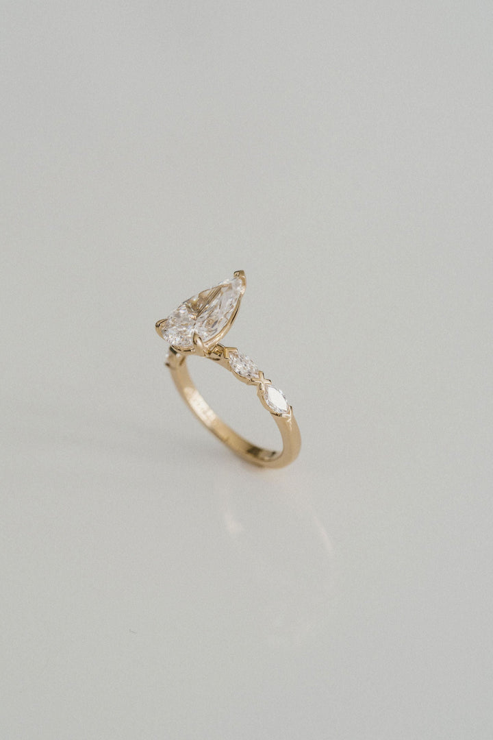 Pear Shape Diamond With Marquise Diamond XO Band