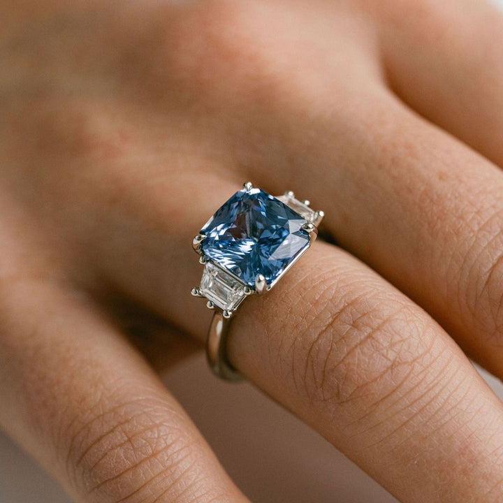 Radiant Cut Blue Sapphire With Trapezoid Diamond Accents