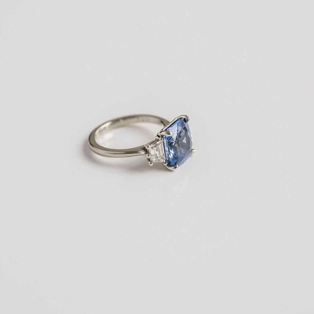 Radiant Cut Blue Sapphire With Trapezoid Diamond Accents