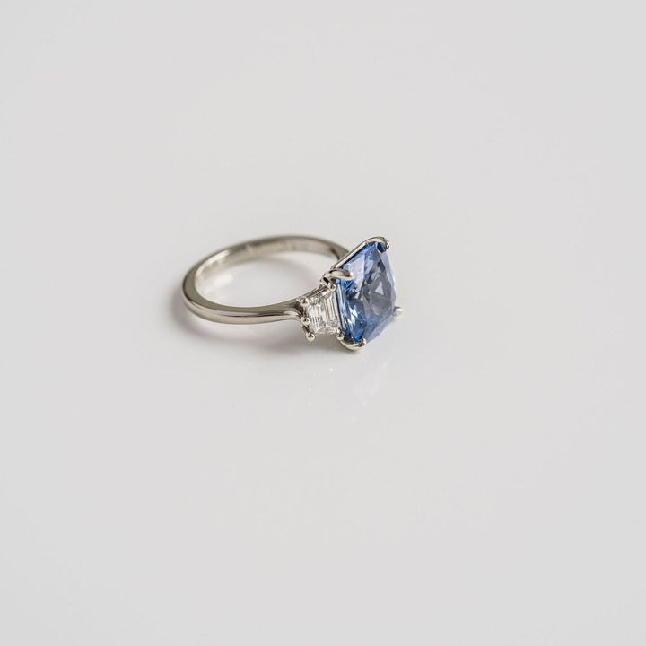 Radiant Cut Blue Sapphire With Trapezoid Diamond Accents
