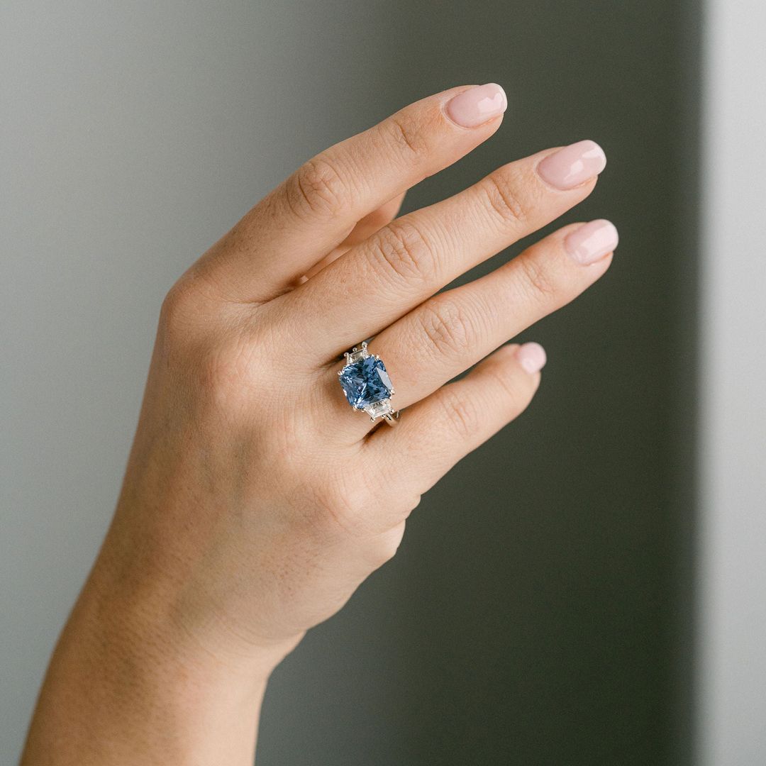 Radiant Cut Blue Sapphire With Trapezoid Diamond Accents