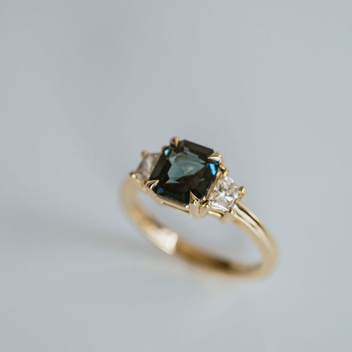 Square Emerald Cut Blue-Green Sapphire with Brilliant Trapezoid Diamond Accents