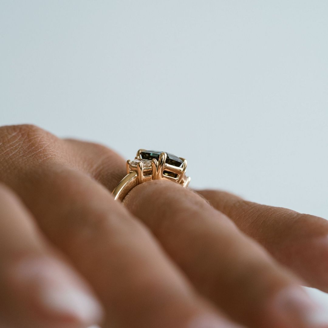 Square Emerald Cut Blue-Green Sapphire with Brilliant Trapezoid Diamond Accents