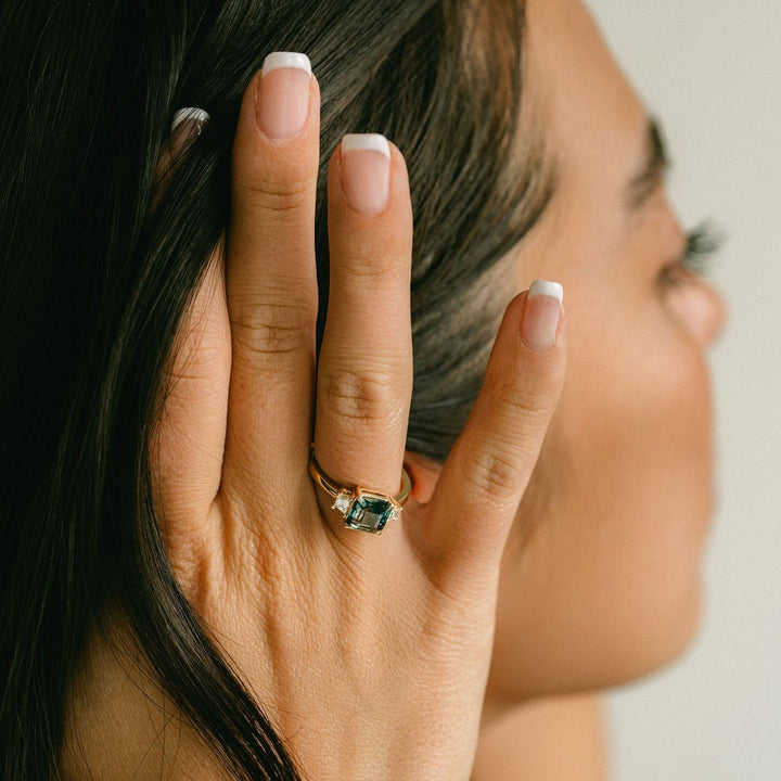 Square Emerald Cut Blue-Green Sapphire with Step Cut Trapezoid Diamond Accents
