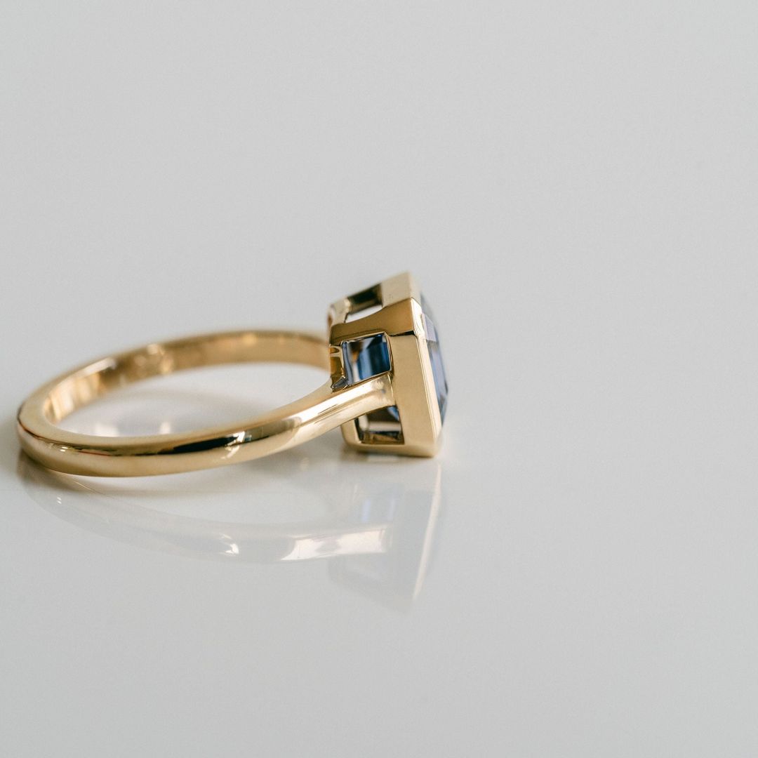 Square Emerald Cut Blue Sapphire Breeze Bezel Ring