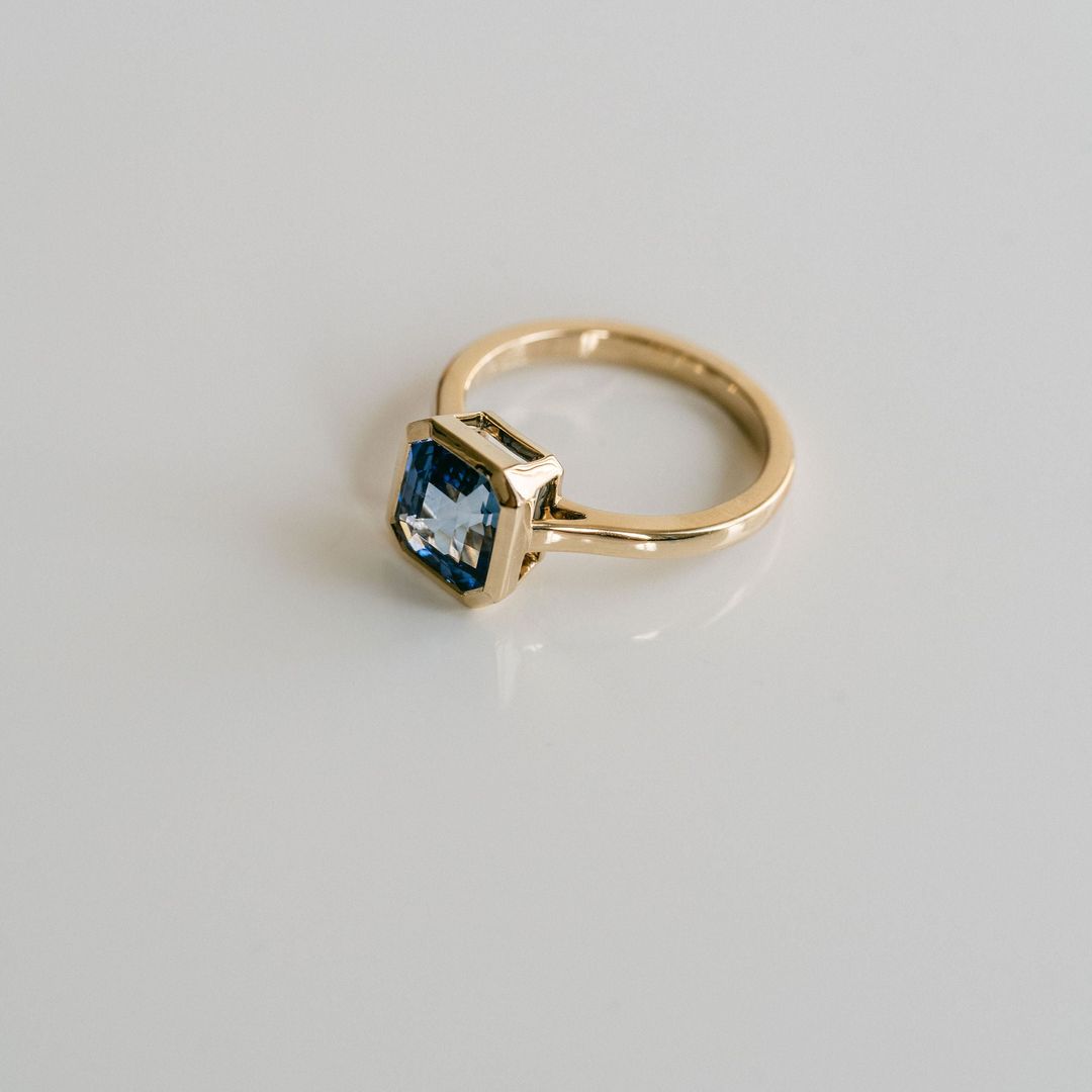 Square Emerald Cut Blue Sapphire Breeze Bezel Ring