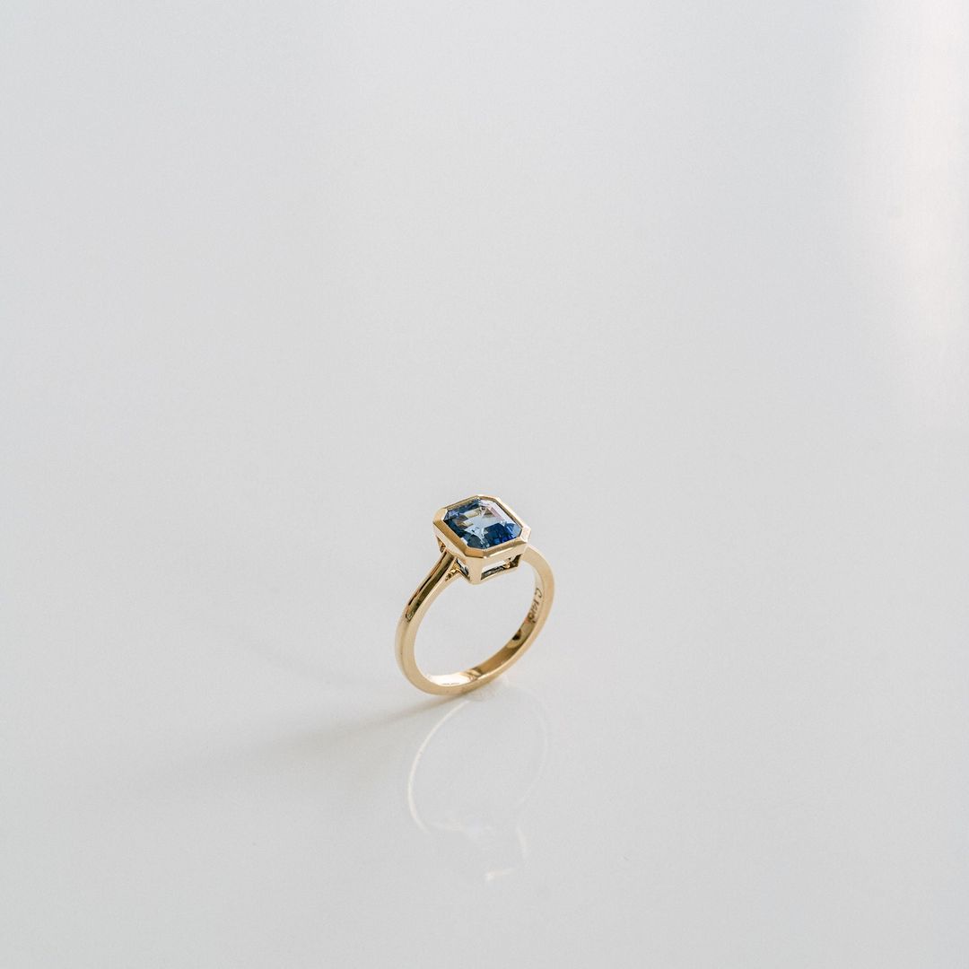 Square Emerald Cut Blue Sapphire Breeze Bezel Ring