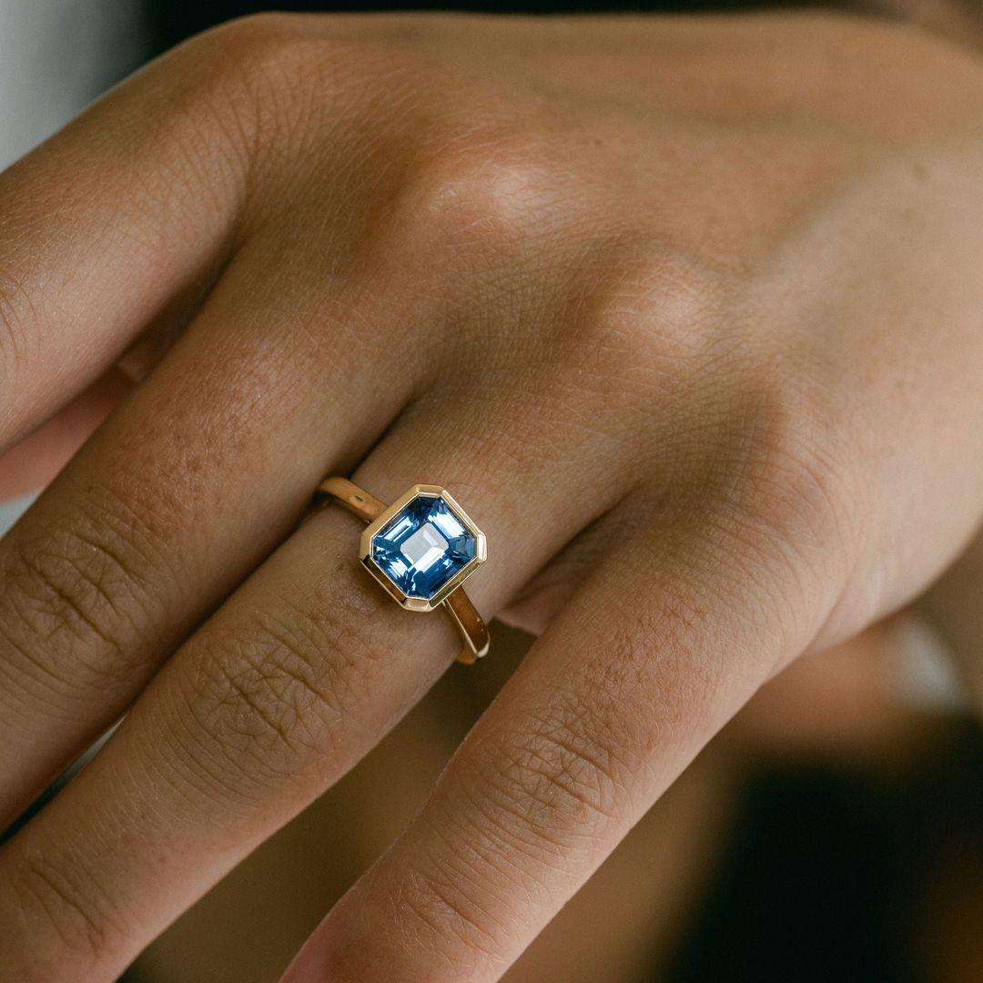 Square Emerald Cut Blue Sapphire Breeze Bezel Ring