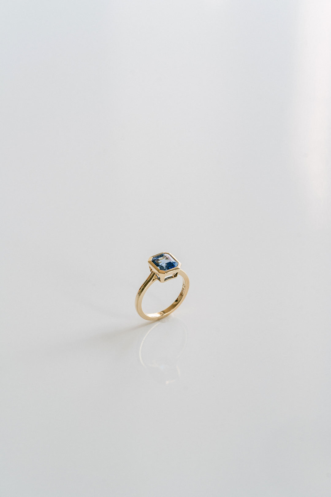 Square Emerald Cut Blue Sapphire Breeze Bezel Ring
