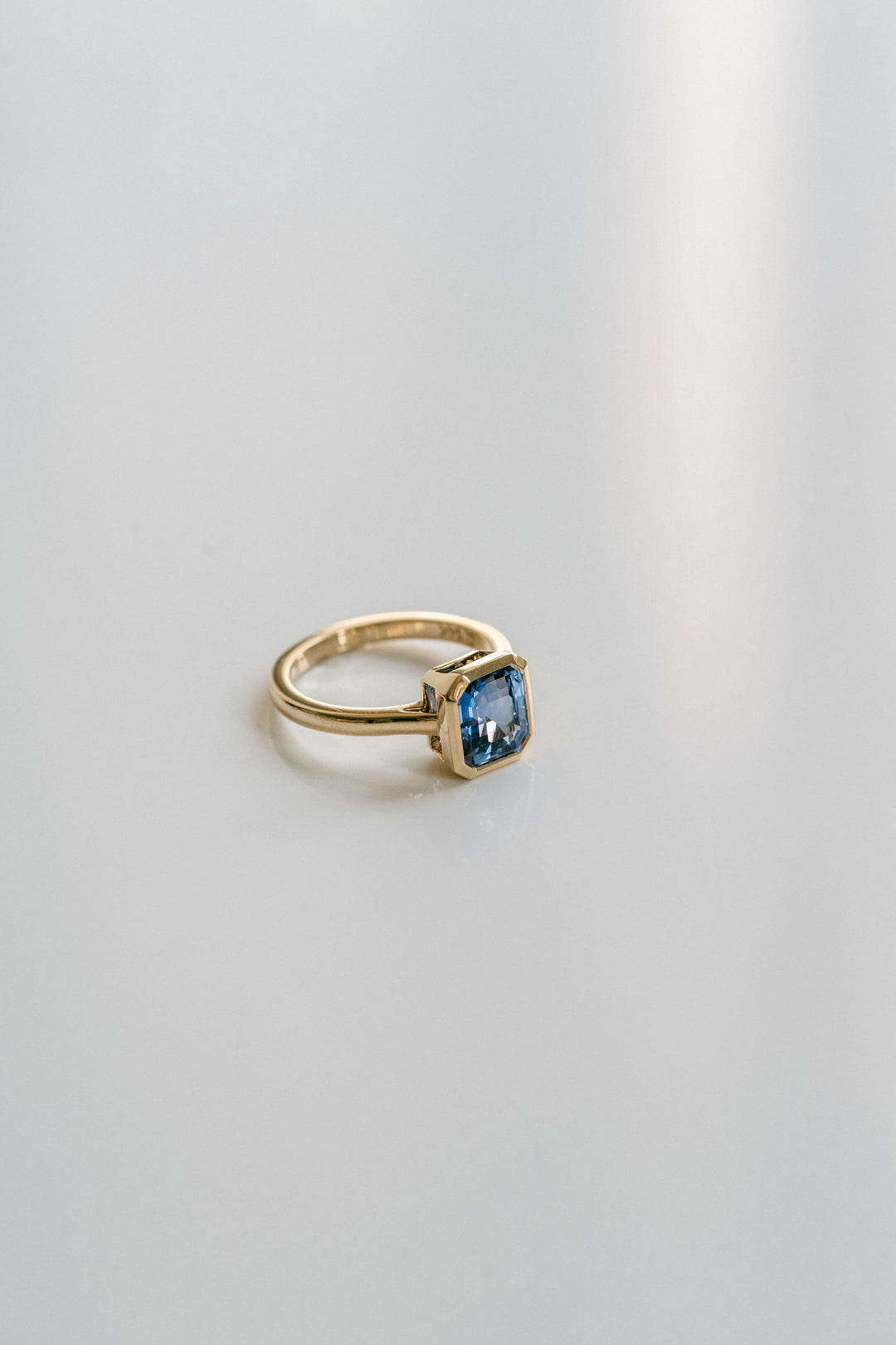 Square Emerald Cut Blue Sapphire Breeze Bezel Ring