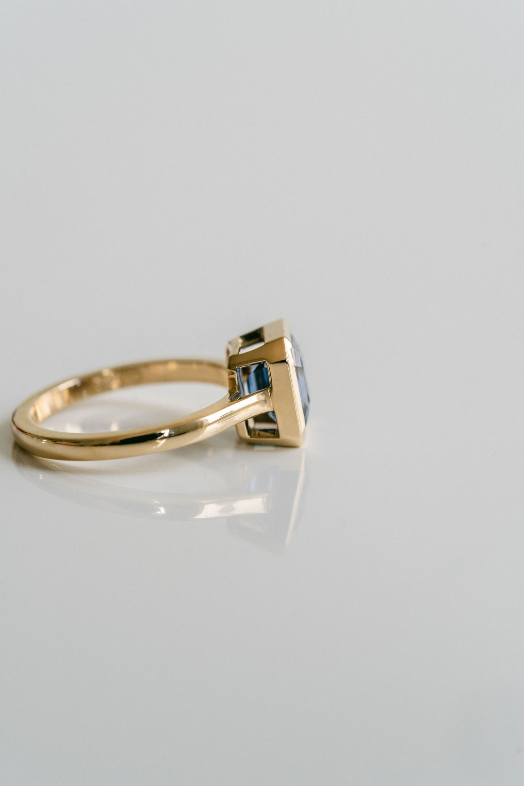 Square Emerald Cut Blue Sapphire Breeze Bezel Ring