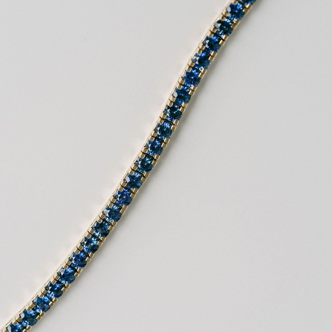 Round Blue Sapphire Tennis Bracelet With Flat Prongs