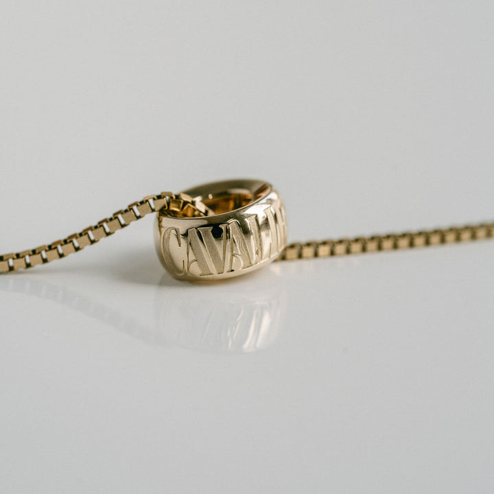 Cavalier Debossed Oval Torus Pendant
