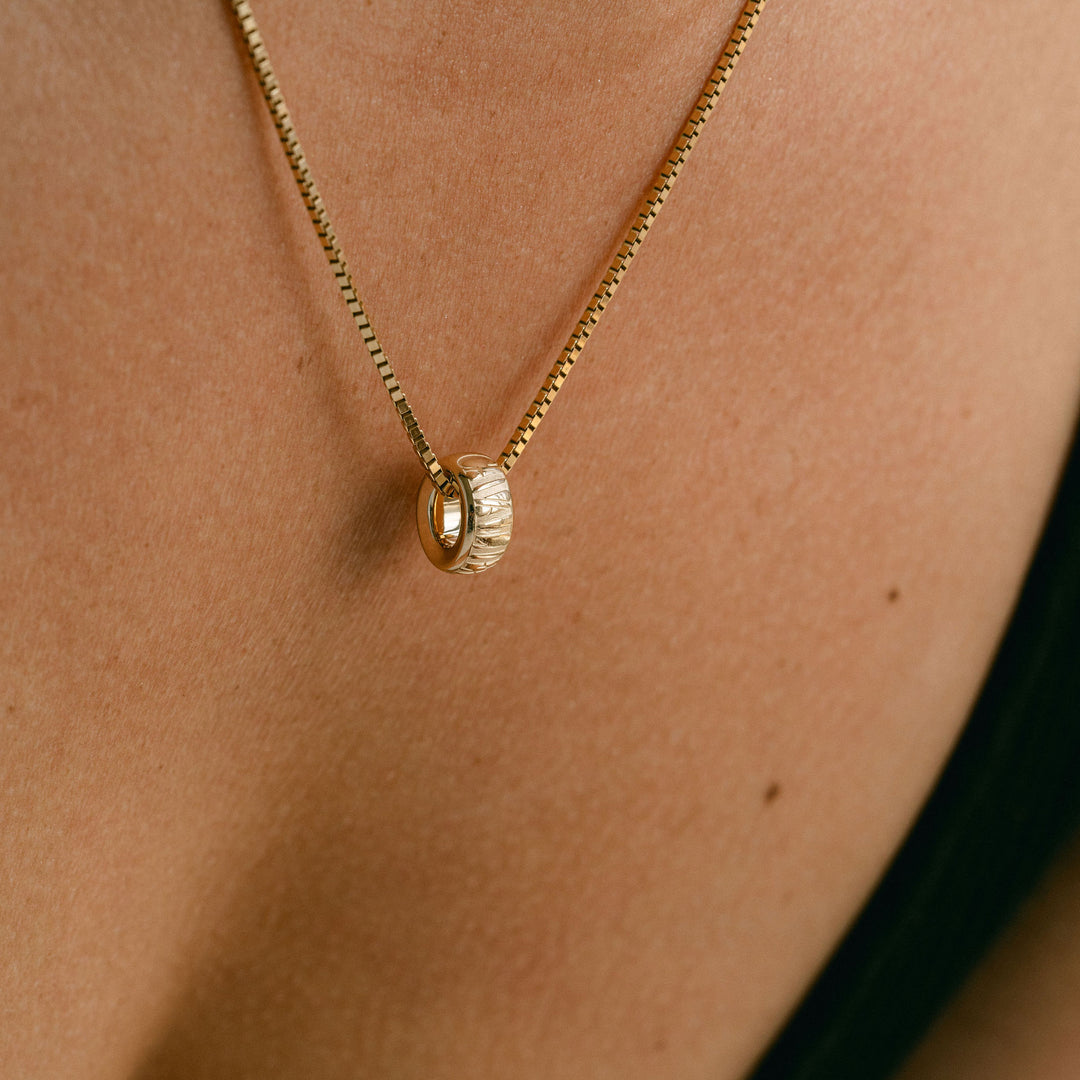 Cavalier Debossed Oval Torus Pendant