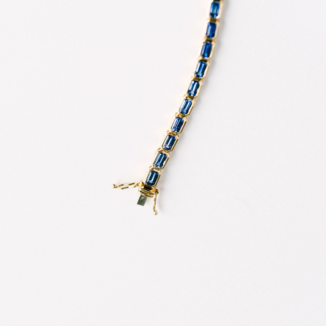 Emerald Cut Blue Sapphire East-West Bezel Tennis Bracelet