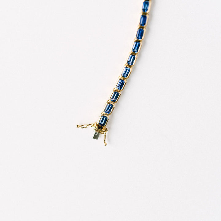 Emerald Cut Blue Sapphire East-West Bezel Tennis Bracelet