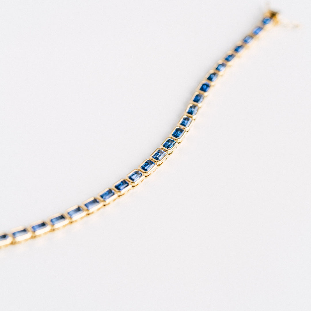 Emerald Cut Blue Sapphire East-West Bezel Tennis Bracelet