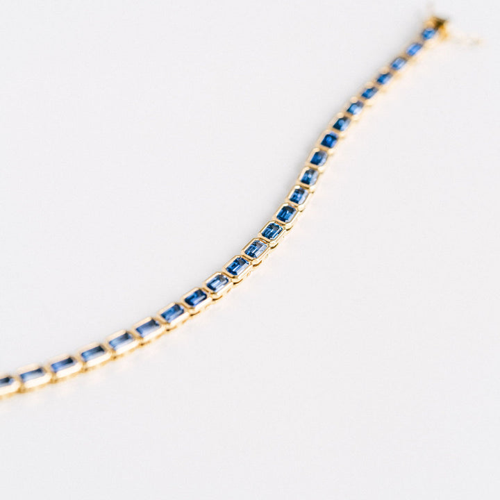 Emerald Cut Blue Sapphire East-West Bezel Tennis Bracelet