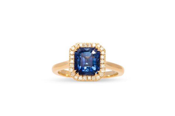 Lively Blue Step Cut Sapphire Ring With A Diamond Halo 14k Yellow Gold