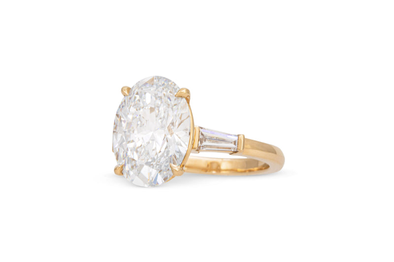 5.00ct. Approx. Oval Diamond Engagement Ring With Tapered Diamond Baguette Accents 14k Yellow Gold
