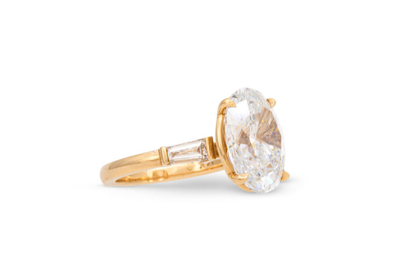 5.00ct. Approx. Oval Diamond Engagement Ring With Tapered Diamond Baguette Accents 14k Yellow Gold
